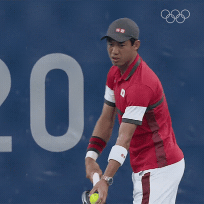 A Man In A Red Shirt With The Number 8 On It Is Playing Tennis GIF