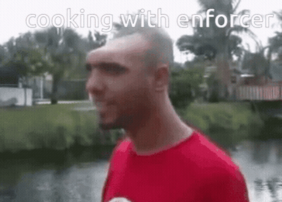 A Man In A Red Shirt With The Words Cooking With Enforcer On The Bottom GIF