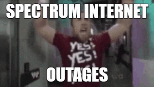 A Man In A Red Shirt With The Words `` Spectrum Internet Outages '' Written On It Is Holding His Arms Up In The Air . GIF