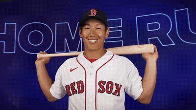 A Man In A Red Sox Jersey Is Holding A Baseball Bat Over His Shoulder GIF