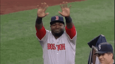 A Man In A Red Sox Uniform Is Standing On A Baseball Field . GIF