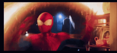 A Man In A Red Spiderman Costume Is Standing In A Room GIF