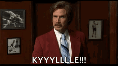 A Man In A Red Suit And Tie Is Saying " Kyyylle " GIF