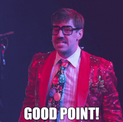 A Man In A Red Suit And Tie Says Good Point GIF