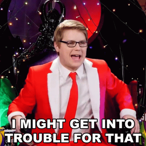 A Man In A Red Suit And White Tie Says I Might Get Into Trouble For That GIF