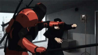 A Man In A Red Suit Is Fighting Another Man In A Black Suit . GIF