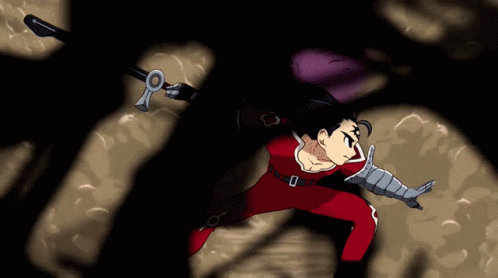 A Man In A Red Suit Is Holding A Sword In His Right Hand GIF