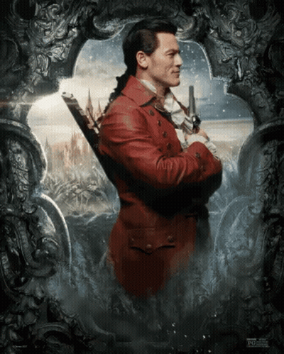 A Man In A Red Suit Is Holding A Sword GIF