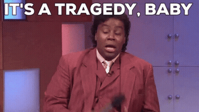 A Man In A Red Suit Says It 'S A Tragedy Baby While Holding A Microphone GIF