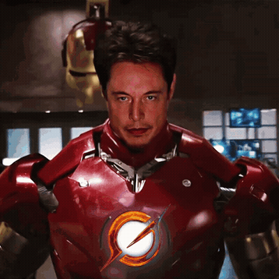 A Man In A Red Suit With A Lightning Bolt On The Chest GIF
