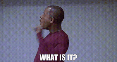 A Man In A Red Sweater Is Giving A Thumbs Up And Says `` What Is It ? '' GIF