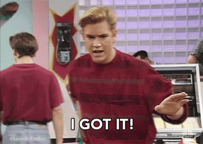 A Man In A Red Sweater Is Saying `` I Got It '' While Standing In Front Of A Machine . GIF