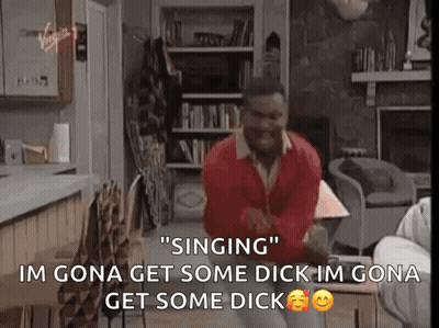 A Man In A Red Sweater Is Singing In A Living Room .. GIF