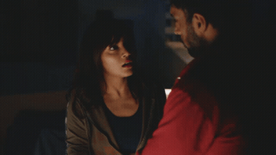 A Man In A Red Sweatshirt Sits At A Desk With A Woman GIF