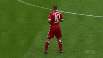 A Man In A Red T-Mobile Jersey Stands In Front Of A Crowd GIF