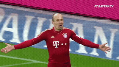 A Man In A Red T-Mobile Jersey Stands On A Field With His Arms Outstretched GIF