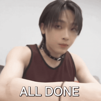 A Man In A Red Tank Top Has His Arms Crossed And The Words All Done Written On His Arm GIF