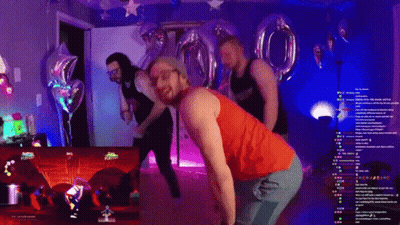 A Man In A Red Tank Top Is Dancing In Front Of A Screen That Says Just Dance On It GIF