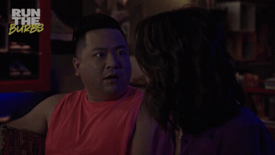 A Man In A Red Tank Top Is Talking To A Woman With The Words Freaky Streak Above Him GIF