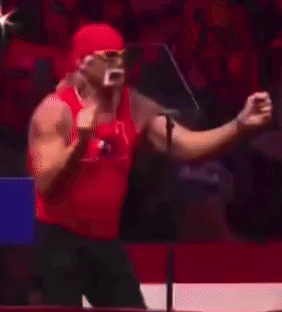 A Man In A Red Tank Top Stands In Front Of A Sign That Says Aga On It GIF