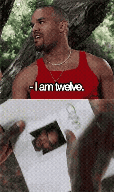 A Man In A Red Tank Top That Says I Am Twelve GIF
