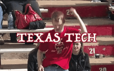 A Man In A Red Texas Tech Shirt Is Sitting On A Bench GIF