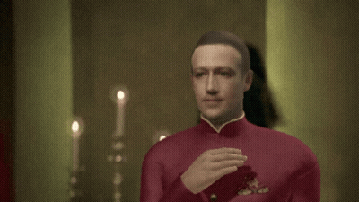 A Man In A Red Uniform Is Waving His Hand In Front Of A Woman GIF