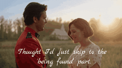 A Man In A Red Uniform Looks At A Woman In A White Dress GIF