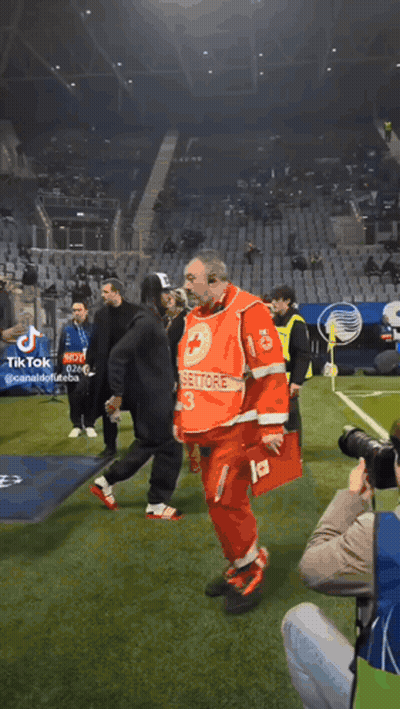 A Man In A Red Uniform With The Number 13 On It Walks On A Soccer Field GIF