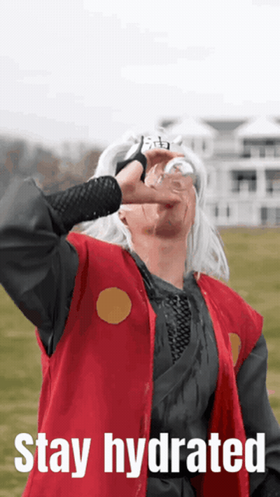 A Man In A Red Vest Is Drinking From A Glass With The Words Stay Hydrated Above Him GIF