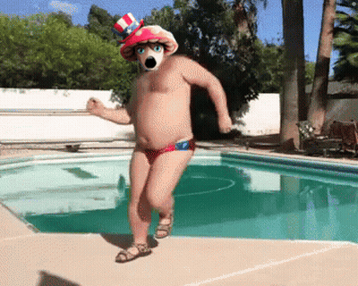 A Man In A Red White And Blue Hat Is Dancing By A Pool GIF