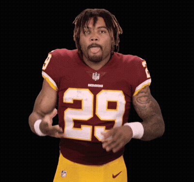 A Man In A Redskins Jersey With The Number 29 On His Chest GIF