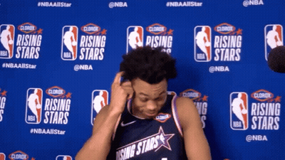 A Man In A Rising Stars Jersey Is Standing In Front Of A Blue Wall GIF