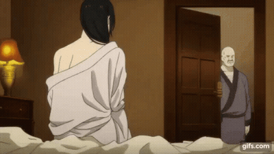 A Man In A Robe Is Standing In A Doorway Next To A Woman In A White Robe . GIF