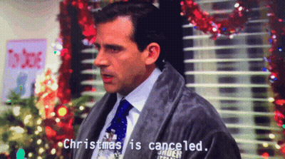 A Man In A Robe Says Christmas Is Canceled In Front Of A Christmas Tree GIF