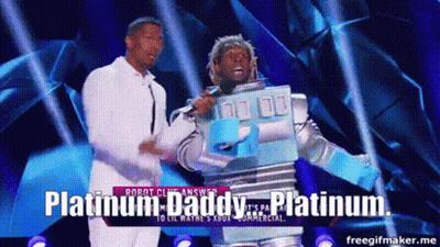 A Man In A Robot Costume Is Standing Next To A Man In A White Shirt And Says Platinum Daddy GIF