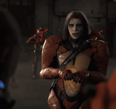A Man In A Robotic Suit Has A Sticker On His Chest That Says ' X ' GIF