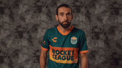 A Man In A Rocket League Jersey Holds A Red Card In Front Of His Face GIF