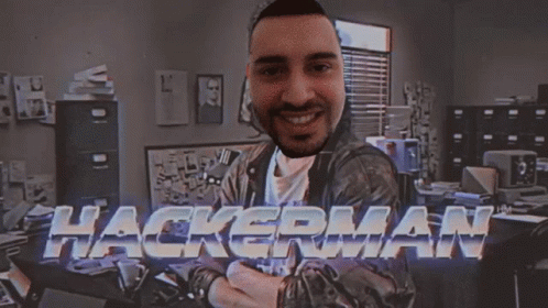 A Man In A Room With The Word Hackerman Behind Him GIF