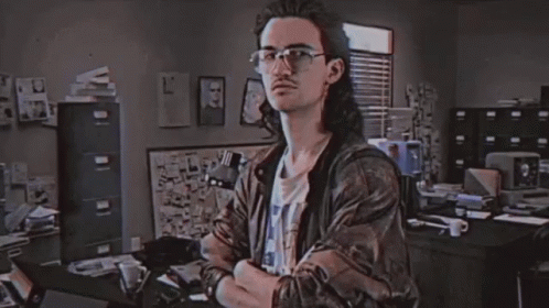A Man In A Room With The Word Hackerman On The Screen GIF