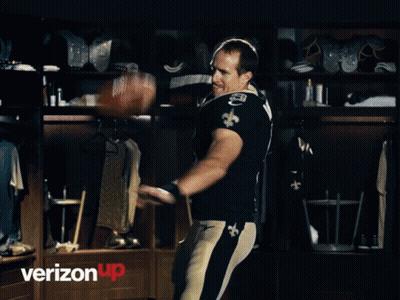 A Man In A Saints Jersey With The Number 9 On His Chest GIF
