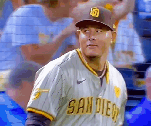 A Man In A San Diego Baseball Uniform Looks To His Left GIF