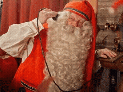 A Man In A Santa Claus Costume Is Talking On A Phone . GIF