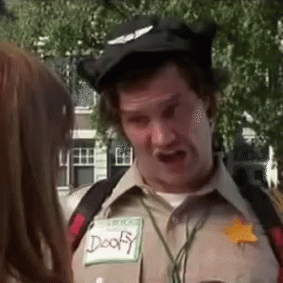 A Man In A Scout Uniform Is Talking To A Girl . GIF