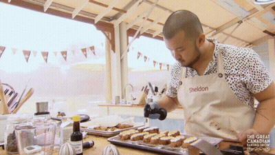 A Man In A Sheldon Apron Is Cooking GIF