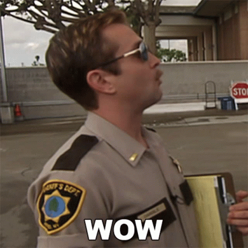 A Man In A Sheriff 'S Uniform Is Holding A Clipboard And Says Wow GIF