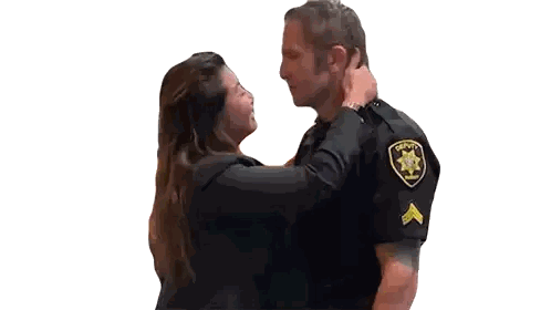 A Man In A Sheriff 'S Uniform Is Kissing A Woman On The Cheek Sticker