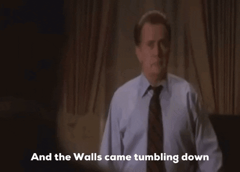 A Man In A Shirt And Tie Is Dancing With The Words " And The Walls Came Tumbling Down " Behind Him GIF