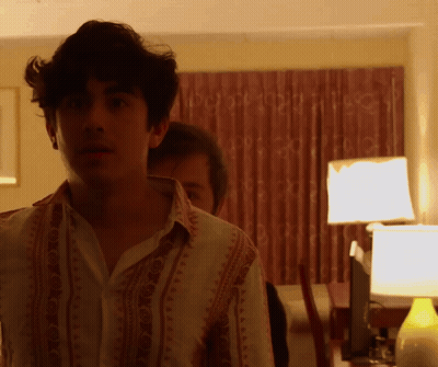 A Man In A Shirt With A Pattern On It GIF