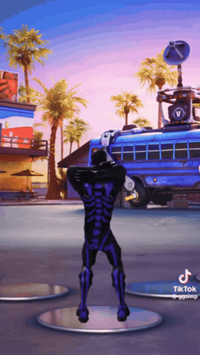 A Man In A Skeleton Costume Is Dancing In Front Of A Blue Bus GIF